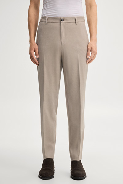 Leads to product detail page "Modular trousers in beige"
