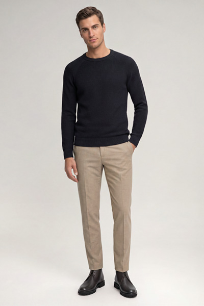 Leads to product detail page "Navy cotton crew-neck jumper"