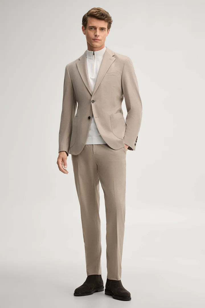 Leads to product detail page "Modular trousers in beige"