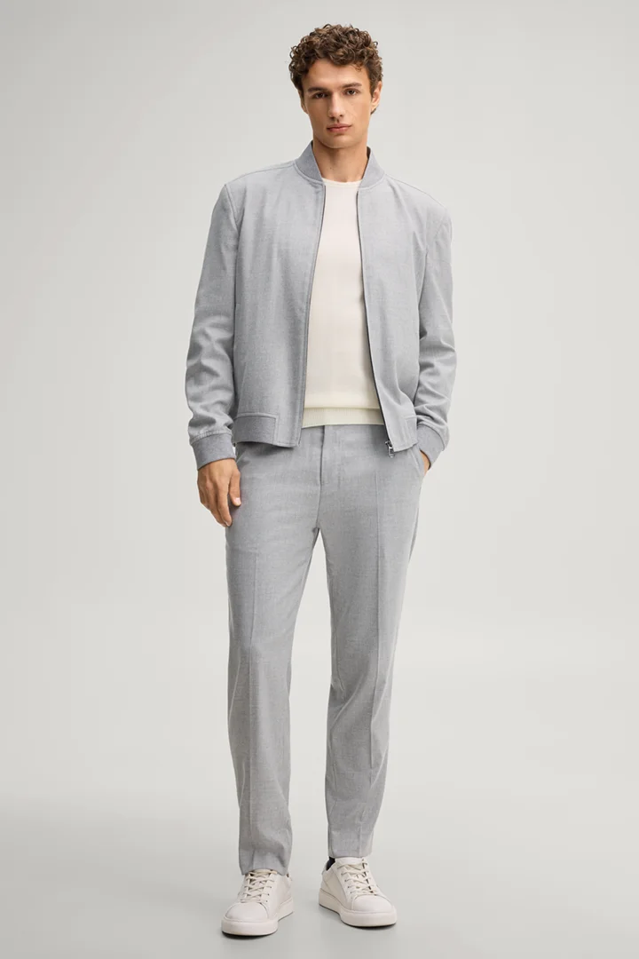 Leads to product detail page "Light grey suit trousers"