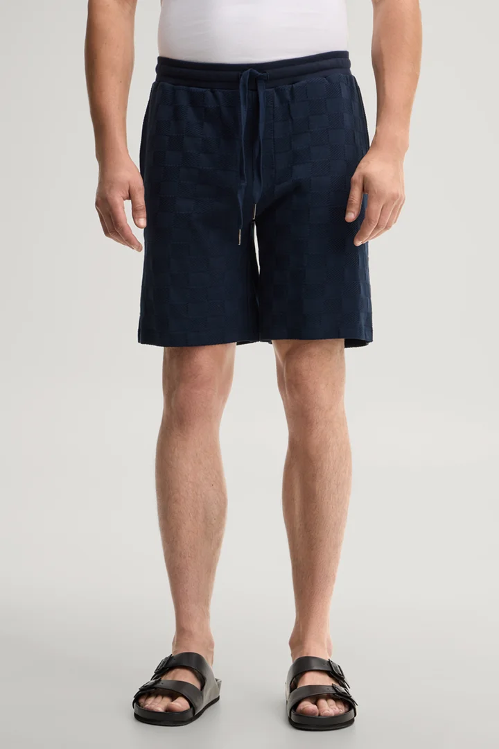 Leads to product detail page "Dark blue loungewear shorts"