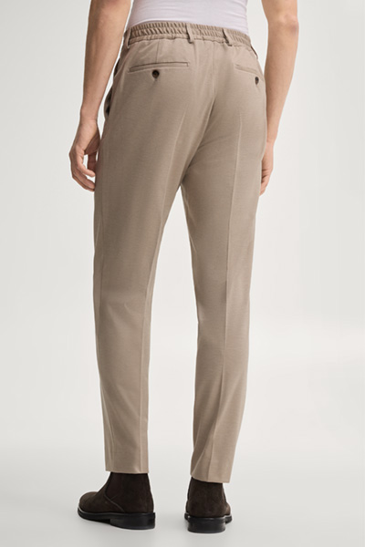 Leads to product detail page "Modular trousers in beige"