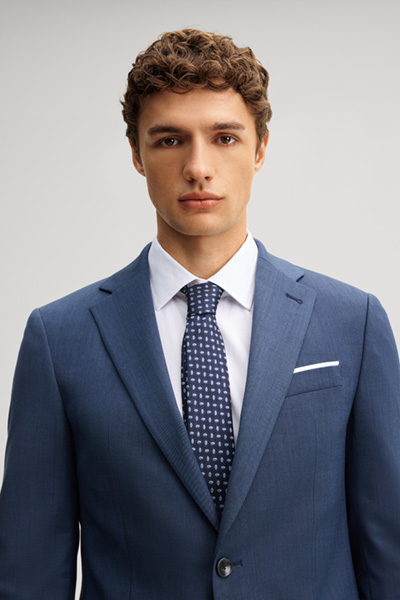 Leads to product detail page "Medium blue wool-blend suit"