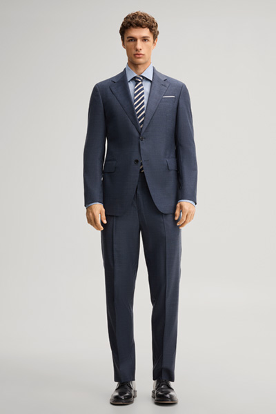Leads to product detail page "Modular trousers in navy, made from virgin wool"