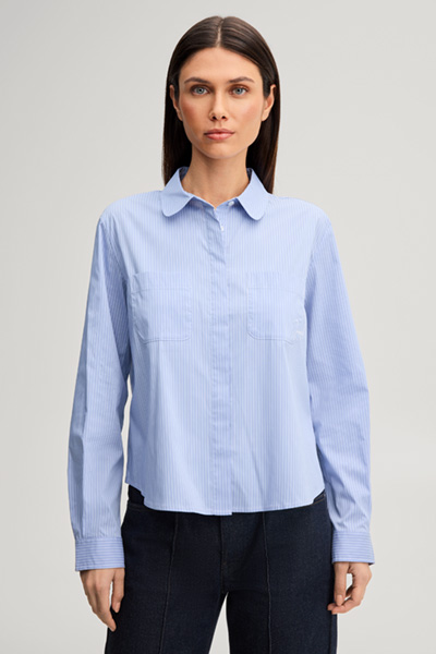 Leads to product detail page "Viscose-blend shirt in light blue and white stripes"