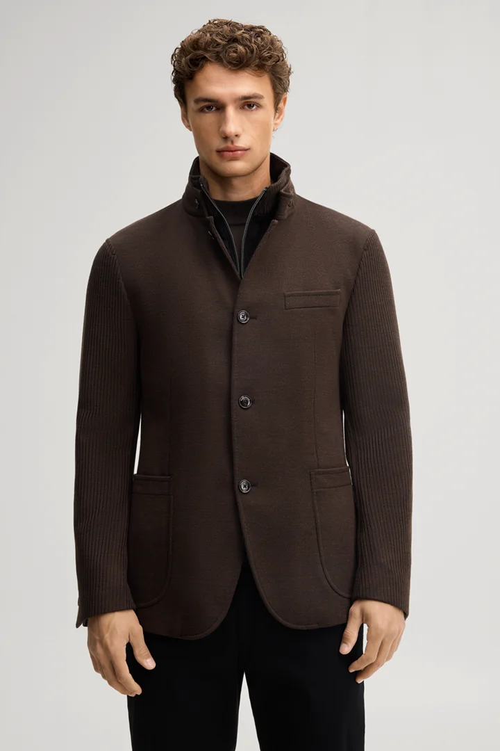 Leads to product detail page "Dark brown suit jacket with a stand-up collar"