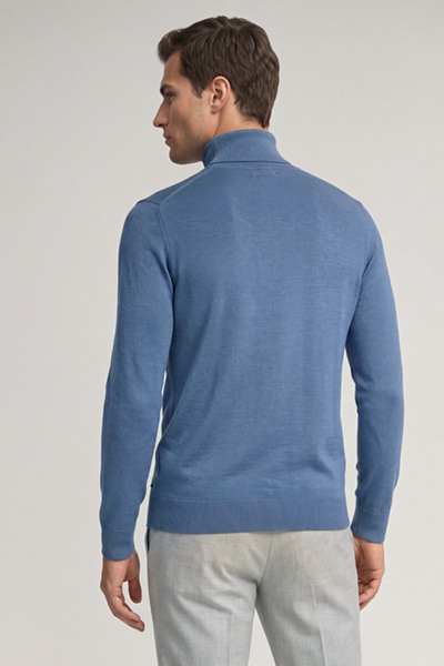 Leads to product detail page "Blue virgin wool roll-neck jumper"