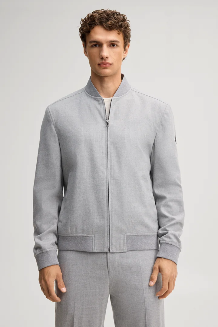Leads to product detail page "Light grey blouson with a college-style collar"