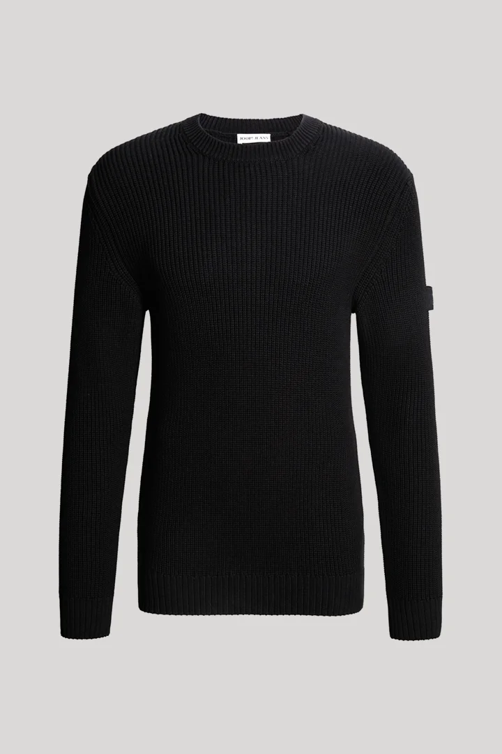 Leads to product detail page "Black cotton crew-neck jumper"