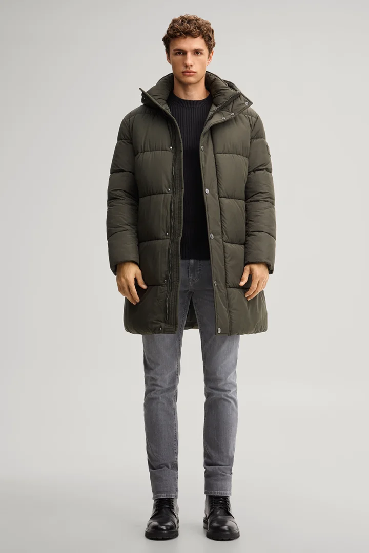 Leads to product detail page "Dark green hooded parka"