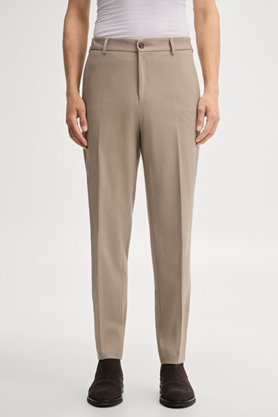 Leads to product detail page "Modular trousers in beige"