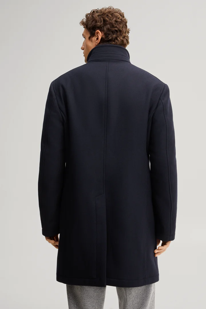 Leads to product detail page "Dark blue wool-blend coat with a stand-up collar"