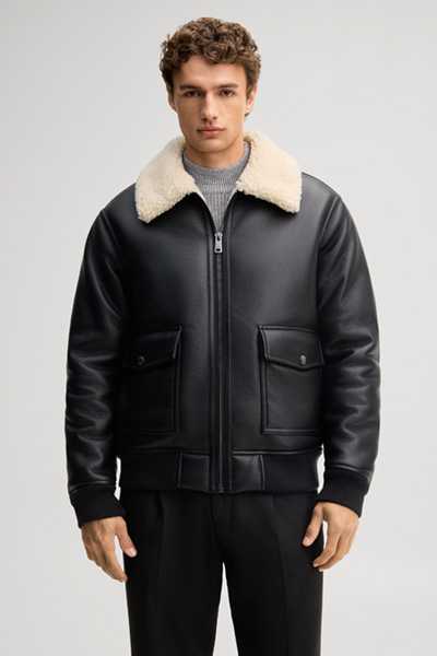 Leads to product detail page "Black vegan leather blouson"