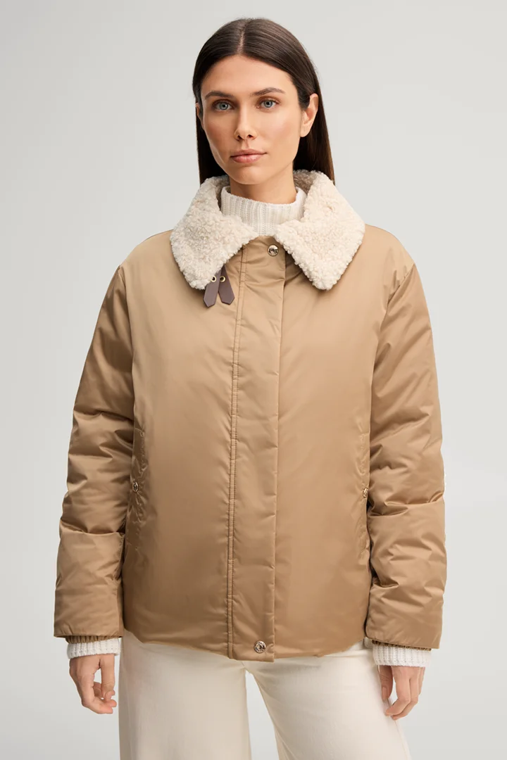 Leads to product detail page "Camel-coloured pilot jacket with teddy collar"