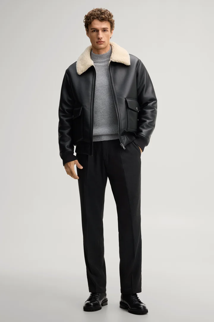 Leads to product detail page "Mid-grey jumper with a stand-up collar"