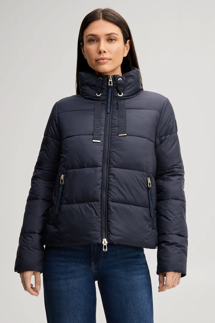 Leads to product detail page "Quilted jacket with a stand-up collar in navy"