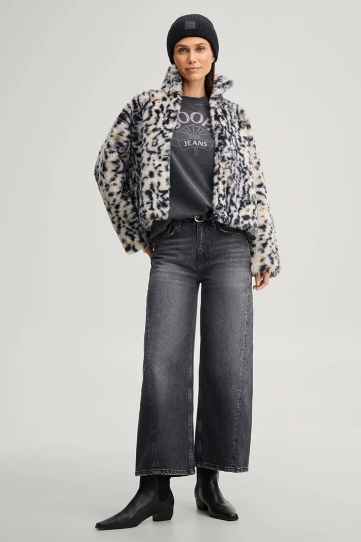 Leads to product detail page "Faux fur jacket with a stand-up collar in a beige and black pattern"