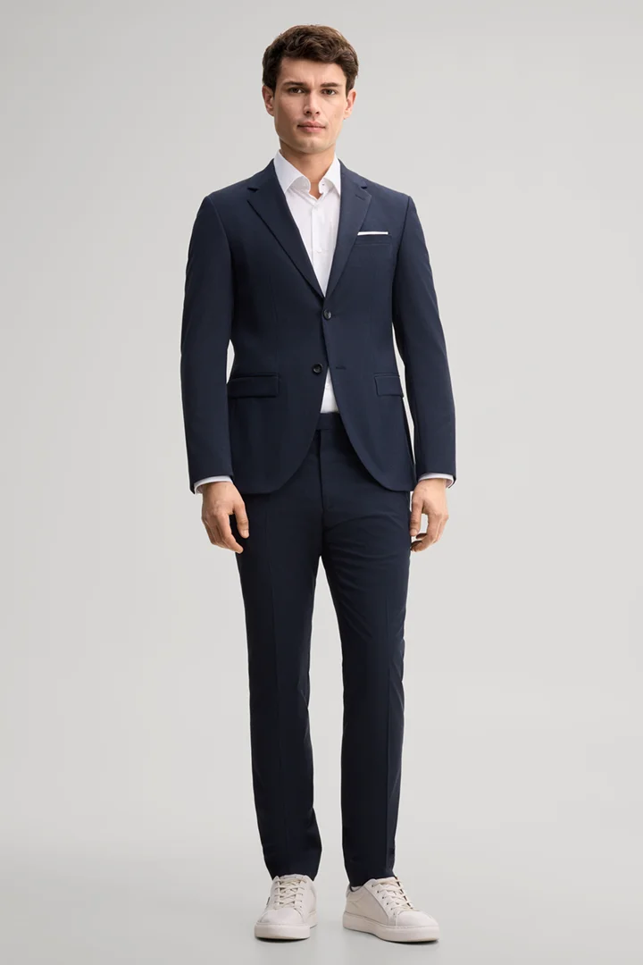 Leads to product detail page "Navy wool-blend suit"