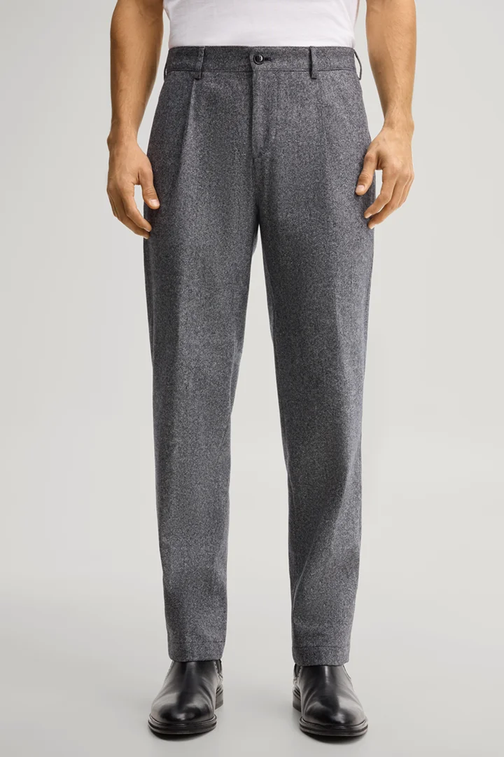 Leads to product detail page "Navy silk-blend pleated trousers"