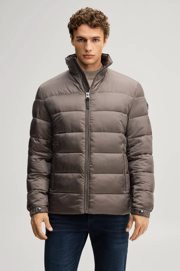 Leads to product detail page "Quilted jacket with a stand-up collar in taupe"