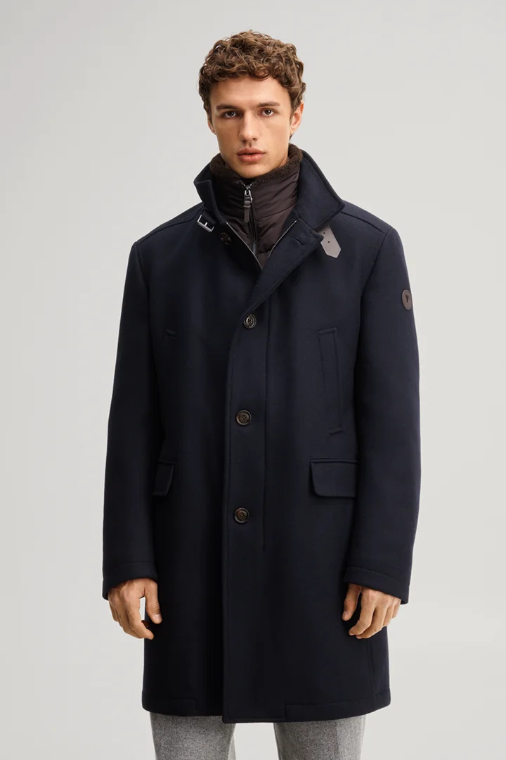 Leads to product detail page "Dark blue wool-blend coat with a stand-up collar"