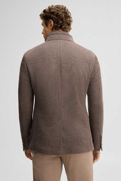Leads to product detail page "Light brown suit jacket with a stand-up collar"