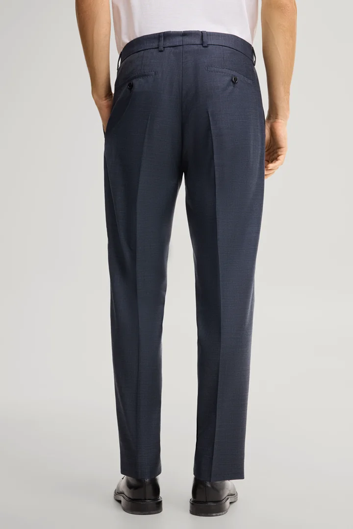 Leads to product detail page "Modular trousers in navy, made from virgin wool"