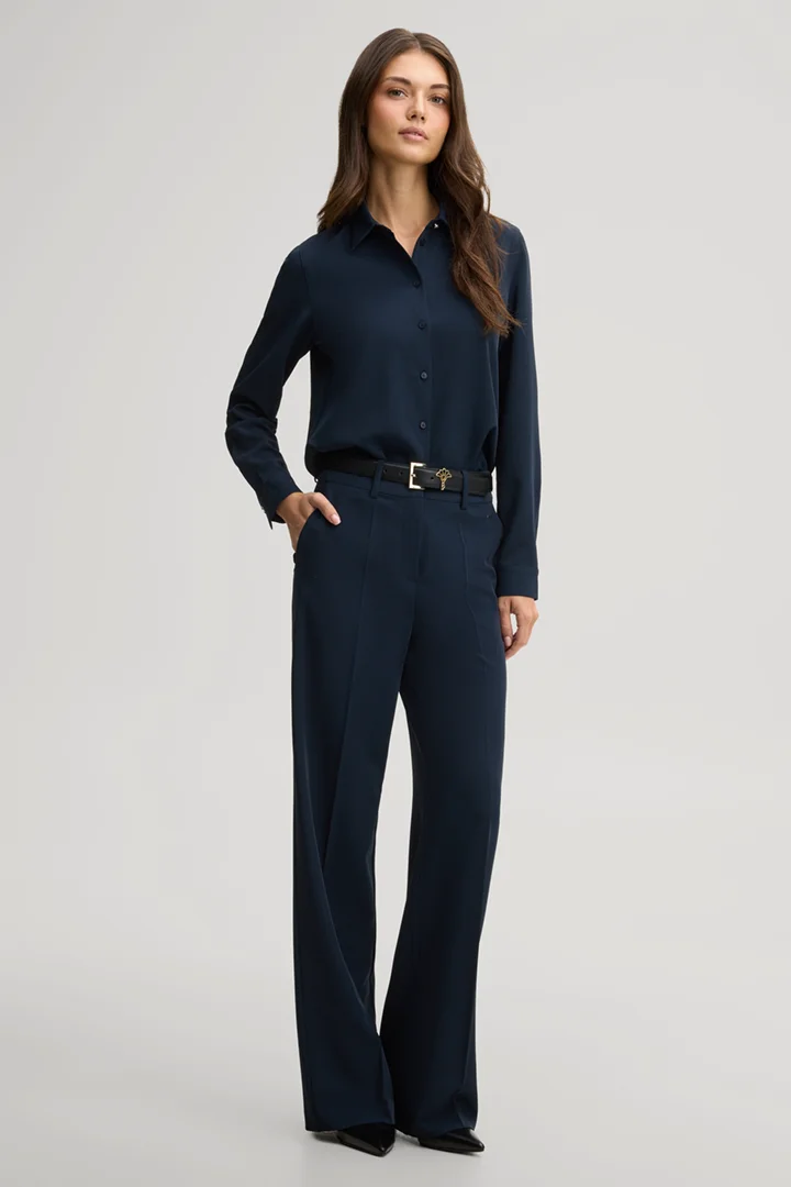 Leads to product detail page "Travel marlene trousers in navy"