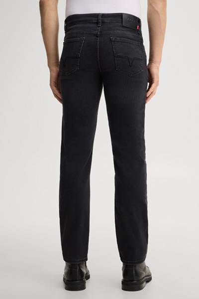 Leads to product detail page "Black stretch five-pocket jeans"
