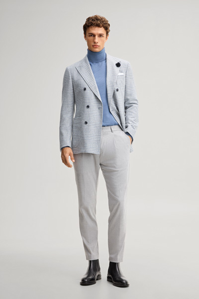 Leads to product detail page "Double-breasted suit jacket in a wool blend with a medium blue checked pattern"