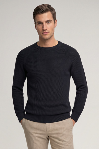 Leads to product detail page "Navy cotton crew-neck jumper"