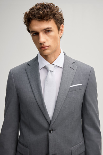 Leads to product detail page "Anthracite-coloured wool-blend suit"