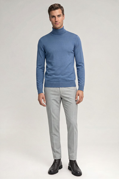 Leads to product detail page "Blue virgin wool roll-neck jumper"