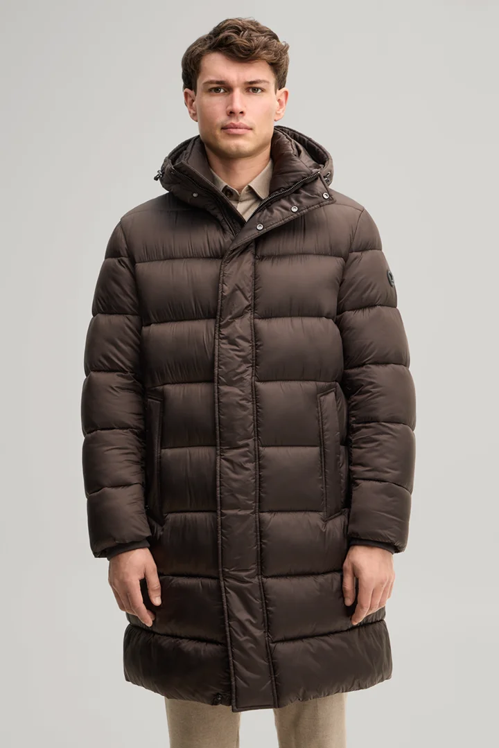 Leads to product detail page "Quilted coat with hood in dark brown"