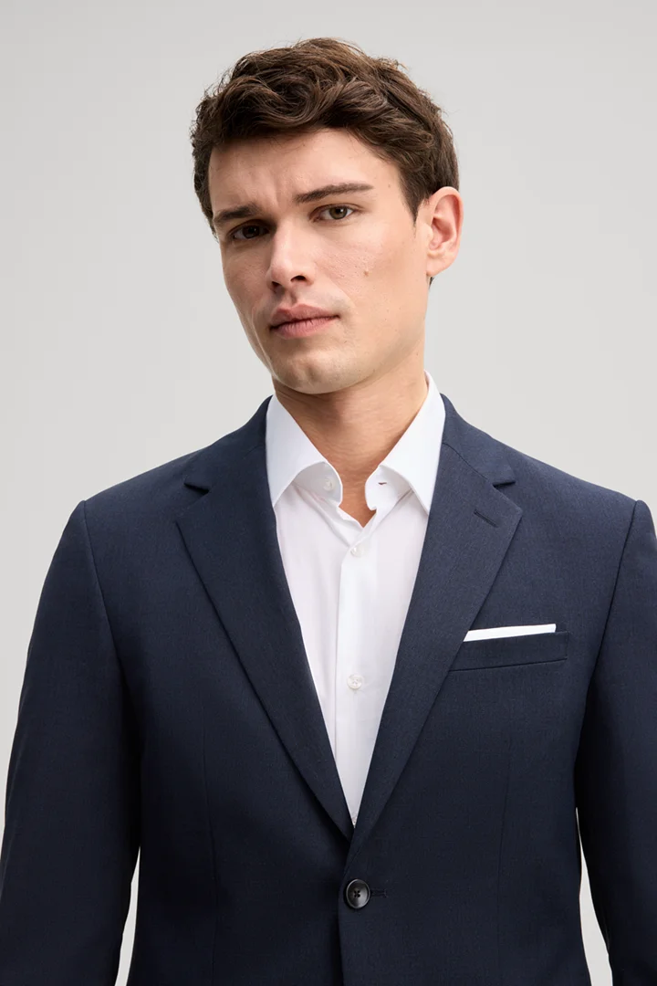 Leads to product detail page "Navy wool-blend suit"
