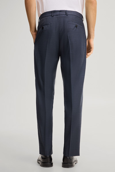 Leads to product detail page "Modular trousers in navy, made from virgin wool"