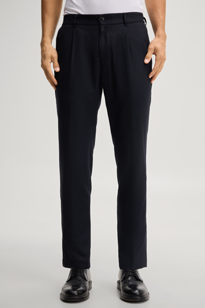 Leads to product detail page "Navy pleated trousers"