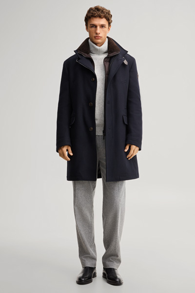 Leads to product detail page "Dark blue wool-blend coat with a stand-up collar"