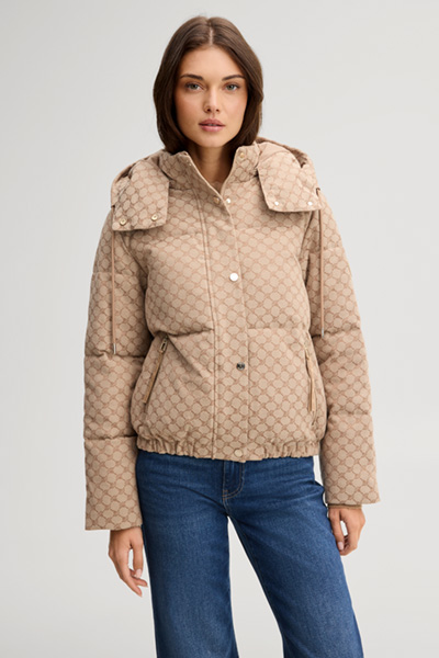 Leads to product detail page "Cornflower jacquard quilted jacket with a camel and dark brown pattern"
