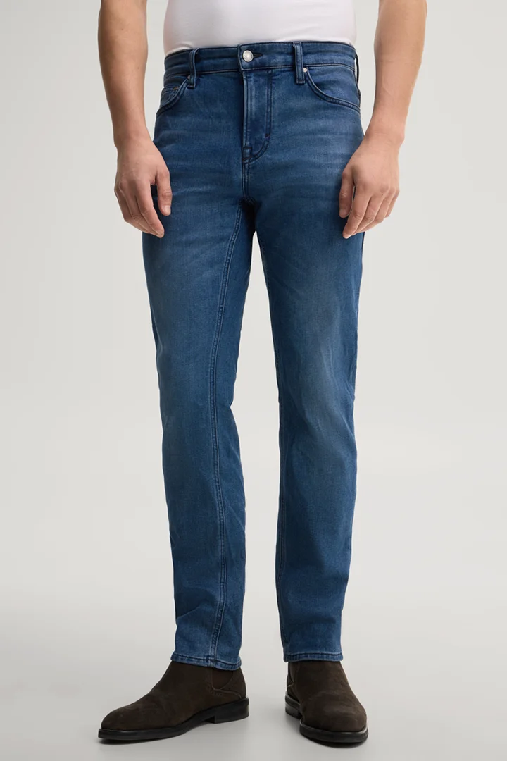 Leads to product detail page "Blue stretch five-pocket jeans"