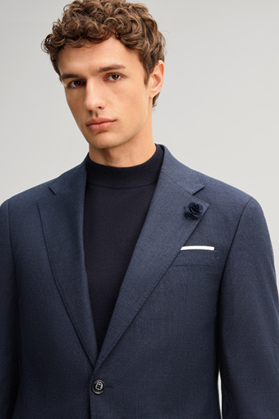 Leads to product detail page "Navy wool-blend suit"