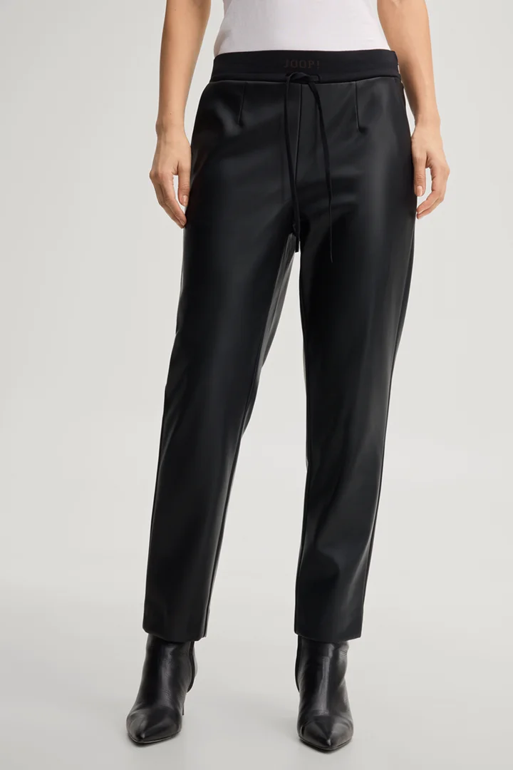 Leads to product detail page "Faux leather cigarette trousers in black"