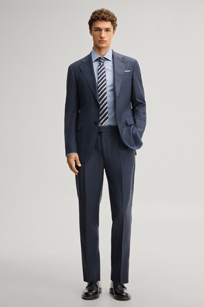 Leads to product detail page "Modular suit jacket in navy, made from virgin wool"