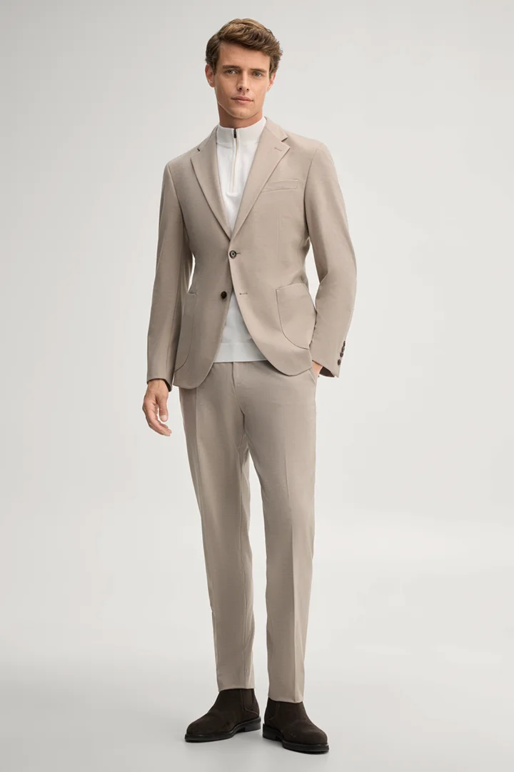 Leads to product detail page "Modular trousers in beige"