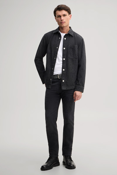 Leads to product detail page "Black stretch five-pocket jeans"
