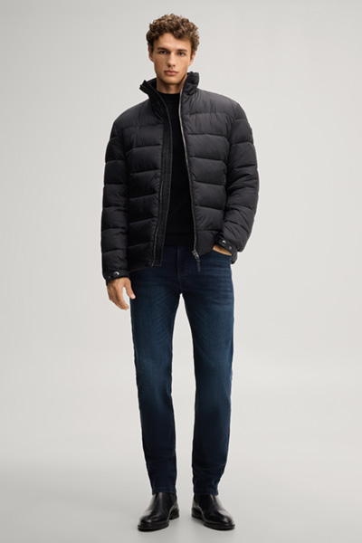 Leads to product detail page "Black quilted jacket with a stand-up collar"