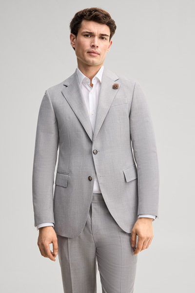 Leads to product detail page "Modular suit jacket in grey, made from virgin wool"