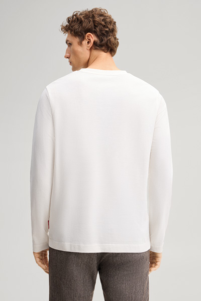 Leads to product detail page "Beige cotton longsleeve top"