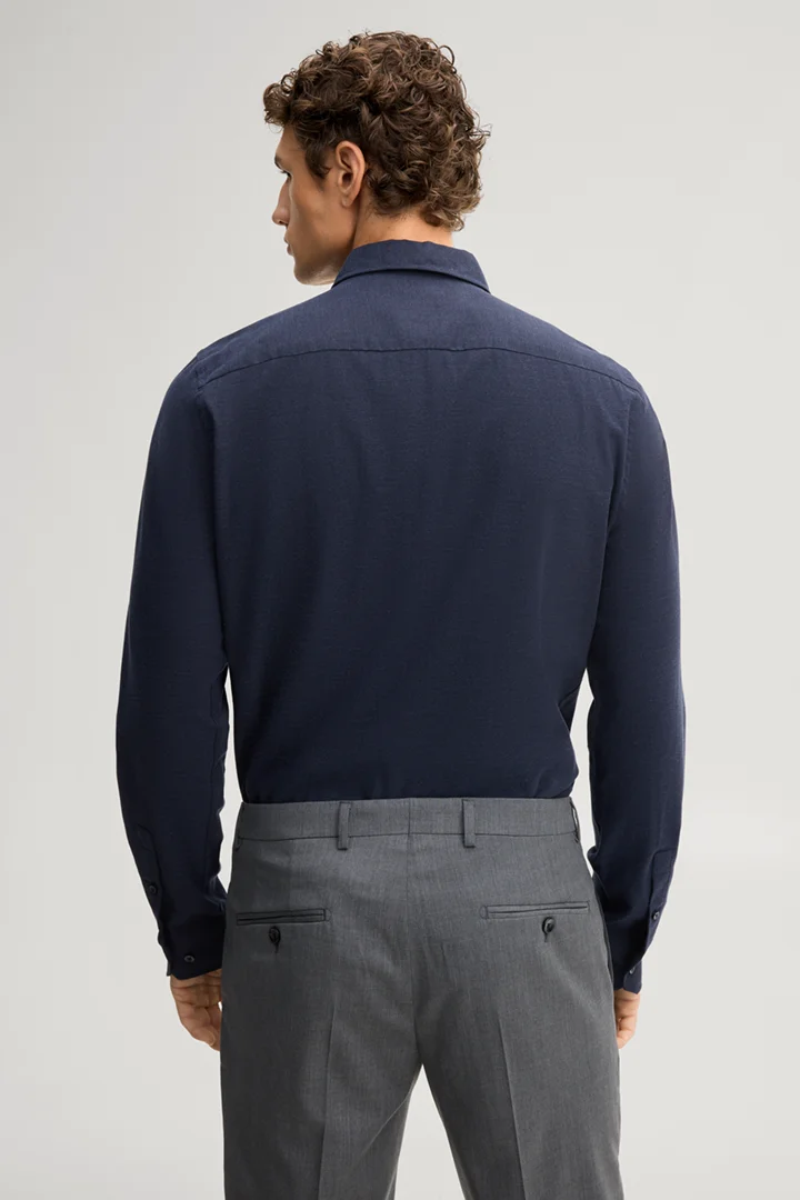 Leads to product detail page "Navy cotton shirt"