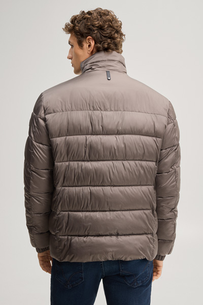 Leads to product detail page "Quilted jacket with a stand-up collar in taupe"
